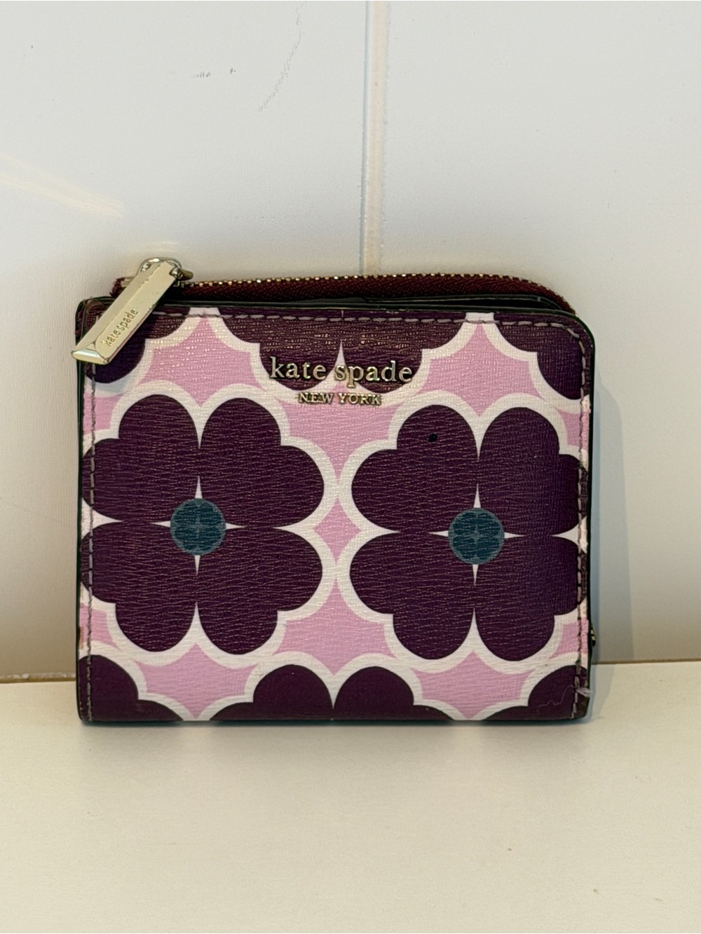 Kate Spade New York bifold wallet in the "Orchid Multi" floral print